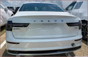 White Volvo sedan rear view